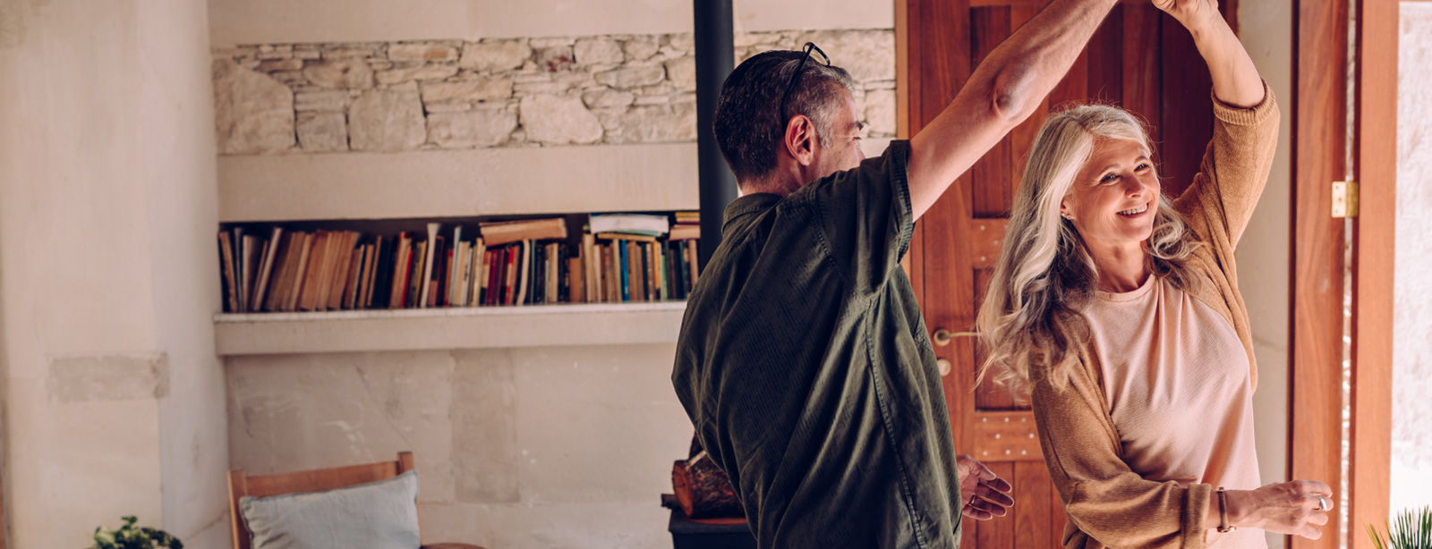 Man and woman dancing in home